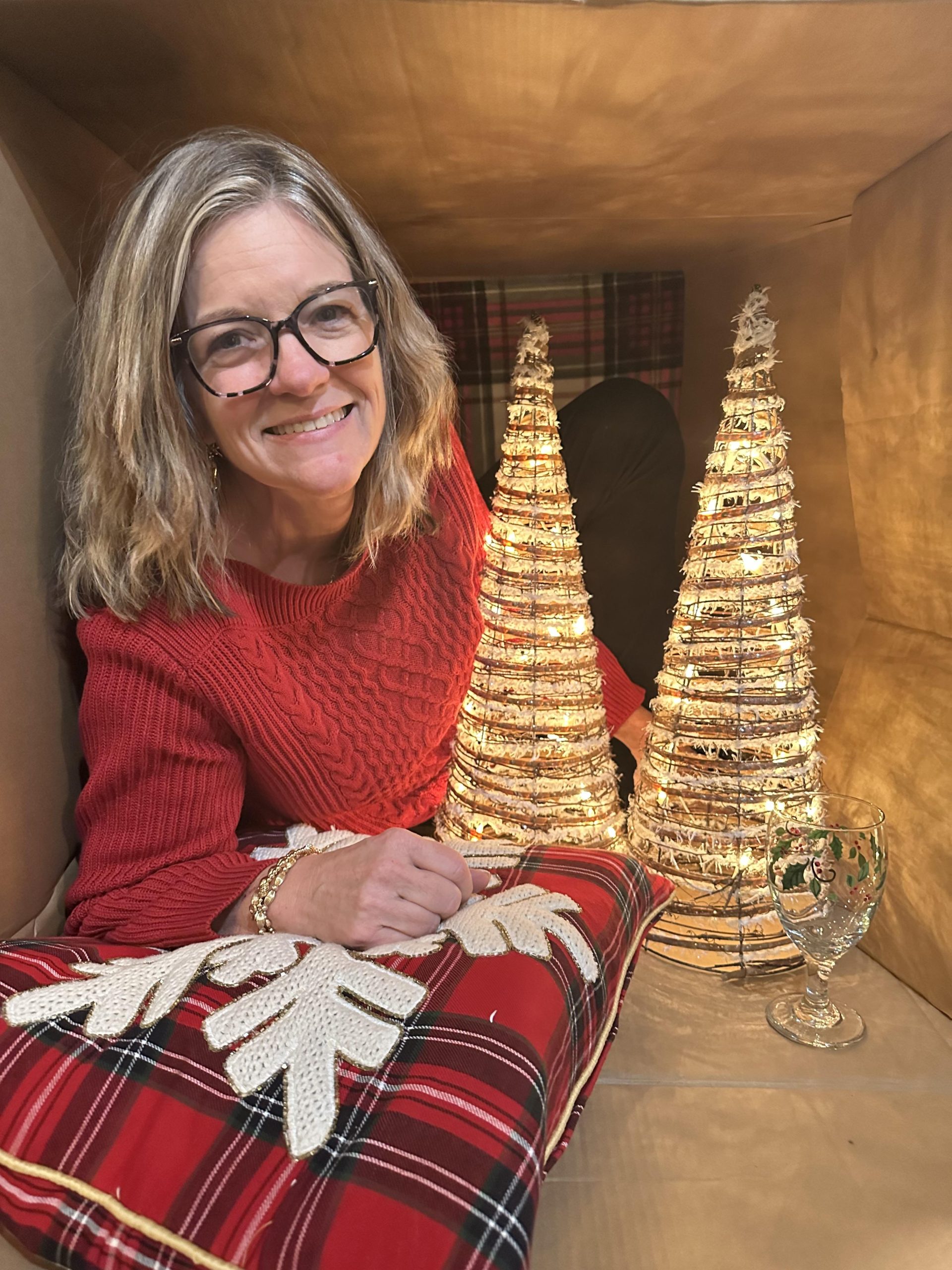picture of realtor posing with christmas tree
