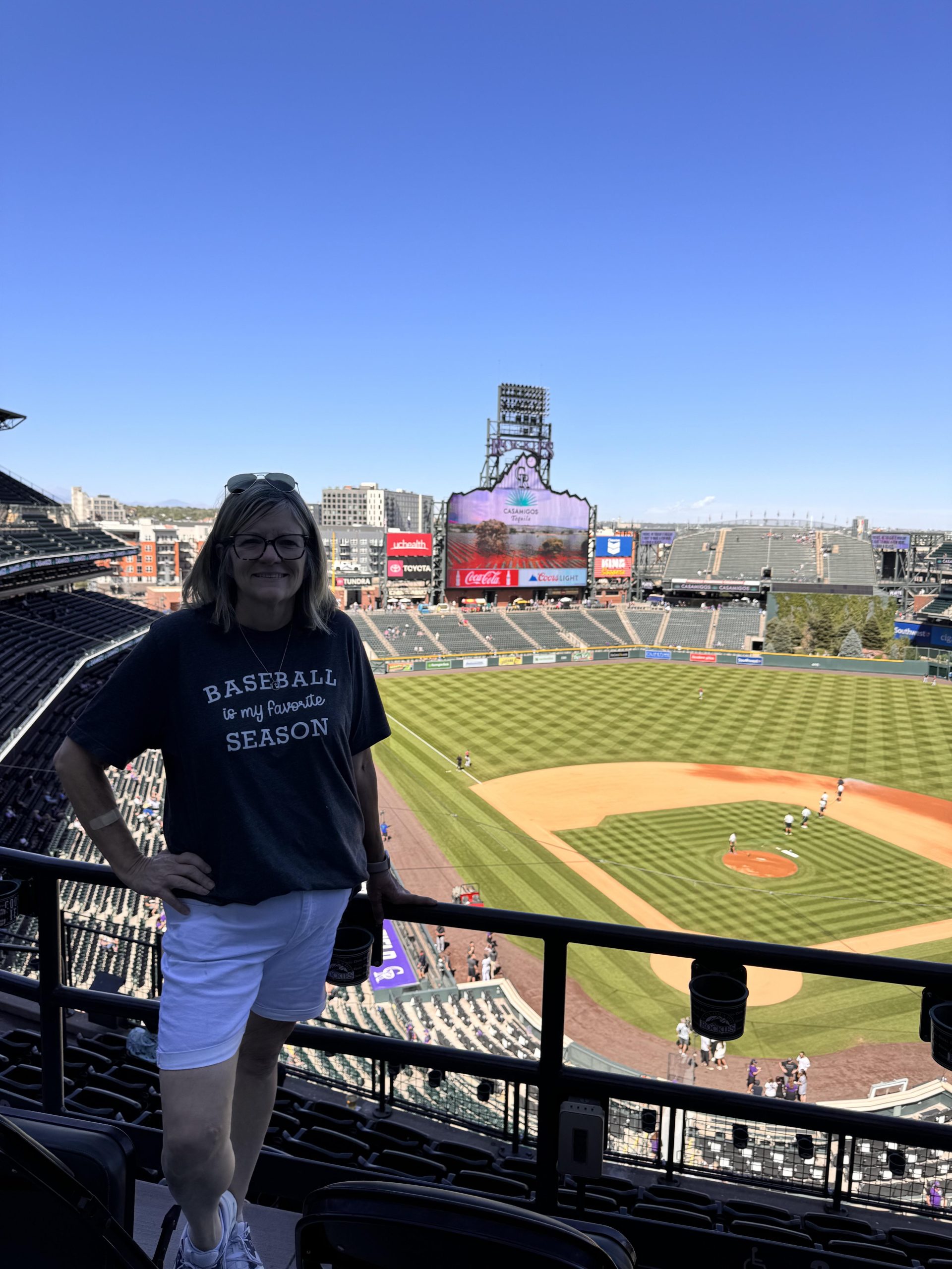Kathy posing at the Colorado Rockies Stadium
