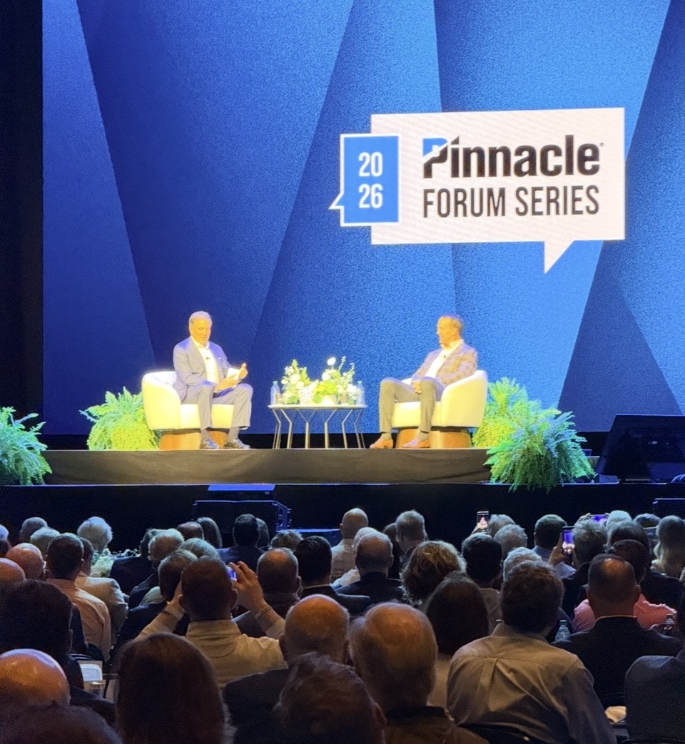 Picture of Peyton Manning and Jim Nance sitting on a stage talking